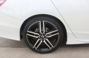 A white car's back tire.