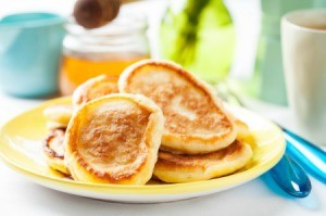 A stack of buttermilk pancakes on a plate.