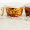 Leftovers stored in clear containers with lids.