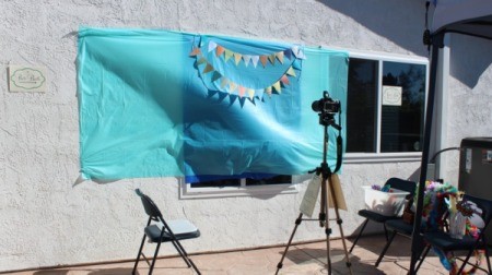 A background placed on a wall to be used as a photo booth.