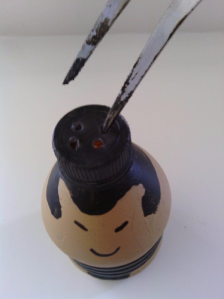 Sumo Wrestler Salt and Pepper Shakers - poking holes in cap