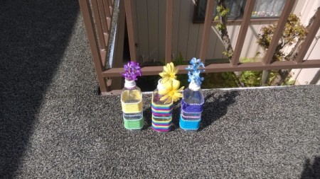 Colorful Hair Tie Vases - three vases with faux flowers on patio