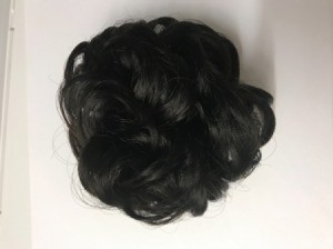 An updo wrap to attach to black hair.