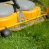 A riding lawnmower in the grass.