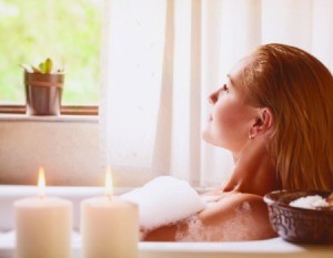 A woman taking a relaxing bath.