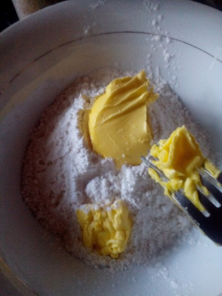 forking butter into flour for dough