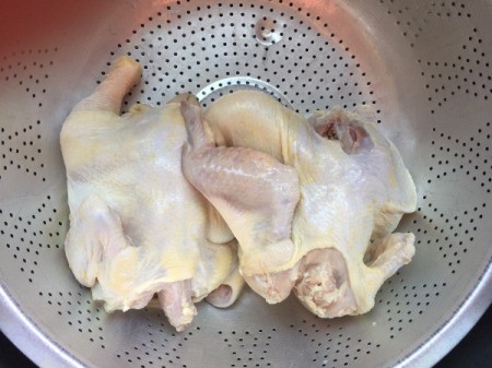 cleaned Game Hens in colander
