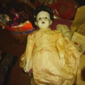 Value of a Lotus Comb Porcelain Doll - doll wearing a long dress