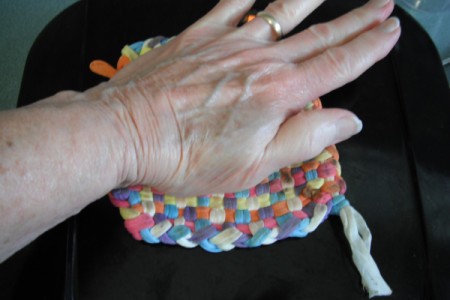 pushing down on grill top to flatten Tator Tots