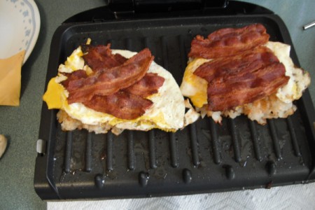 eggs and bacon on Breakfast Sandwich in grill