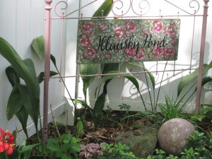 Metal Head and Footboard for Your Garden - blush headboard with sign