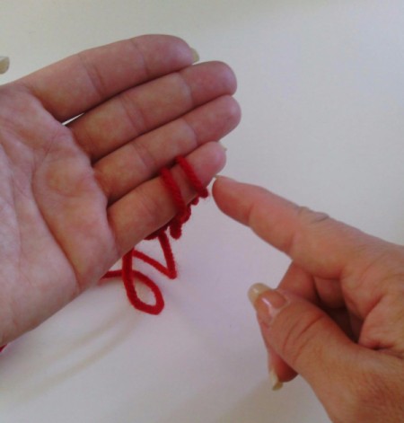 Finger Knit Headband - last finger of binding off process