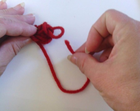 Finger Knit Headband - put tail through last loop