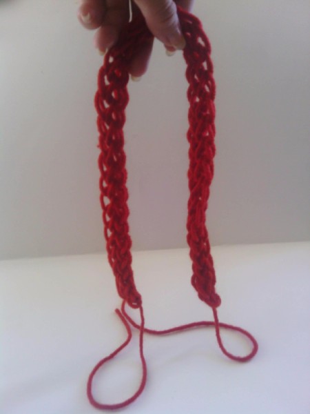 Finger Knit Headband - finished headband with tails of yarn