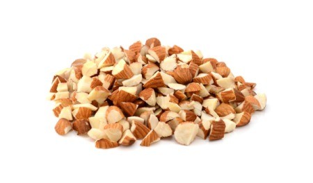 A pile of chopped almonds on a white background.