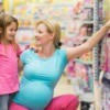A mom and her daughter shopping for toys.