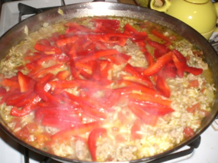 sliced peppers added to pan