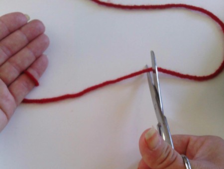 Finger Knit Headband - cut yarn leaving a tail