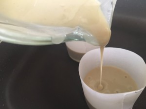 Pouring batter into a ring mold.