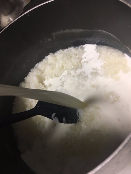 milk added to rice in pan