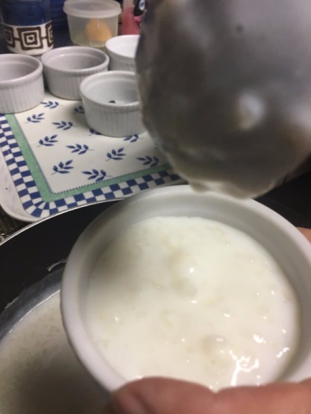 putting Rice Pudding into cups