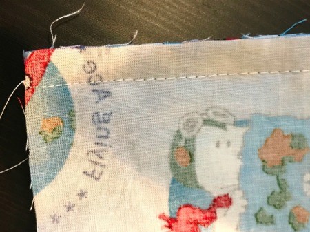 Book Pocket Pillow - long basting stitch and regular near ends