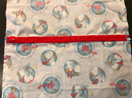 Book Pocket Pillow - Lay the zipper onto the seam, face down. Stitch around all 4 sides of the zipper.