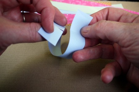 Fluttering Fish - Bend the strip around and slot one cut into the other.