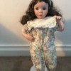 Identifying Porcelain Dolls - doll wearing one piece long leg outfit