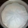 Wax paper cut to fit in a round pan.