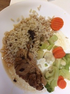 Chicken Piccata, rice and vegetables on plate