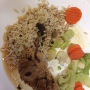 Chicken Piccata, rice and vegetables on plate