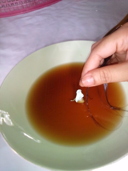 A piece of gum that has been removed from a child's hair.