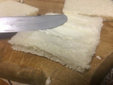 buttering bread slices