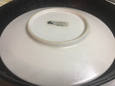 One Pan Apple Charlotte covered by plate