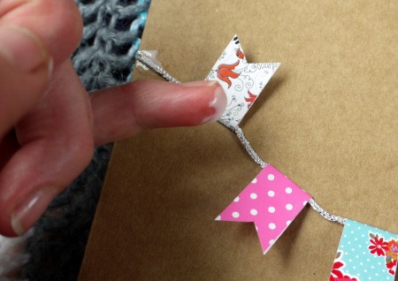 Bunting Greetings Card - add a dab of glue to keep the little flags in place