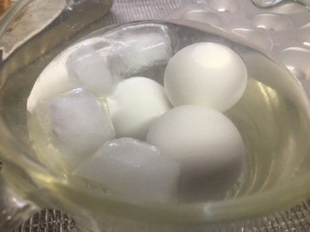 Hard cooked eggs in ice water.