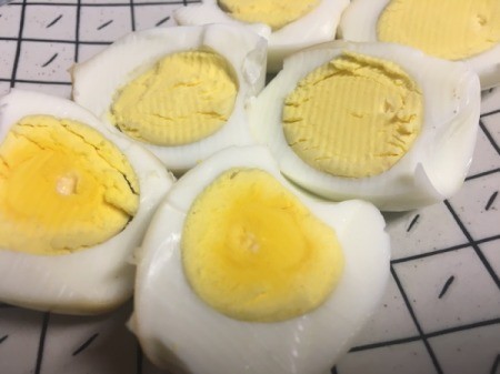 Hard cooked eggs, sliced in half.