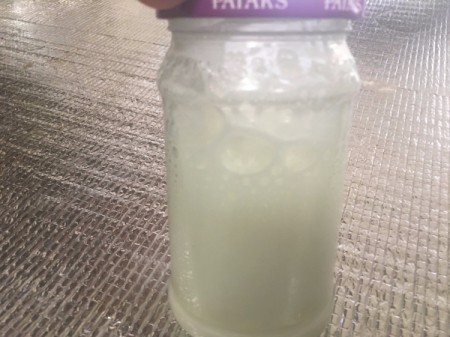 A jar of frothed milk.