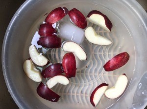 Cut apples soaking in water.