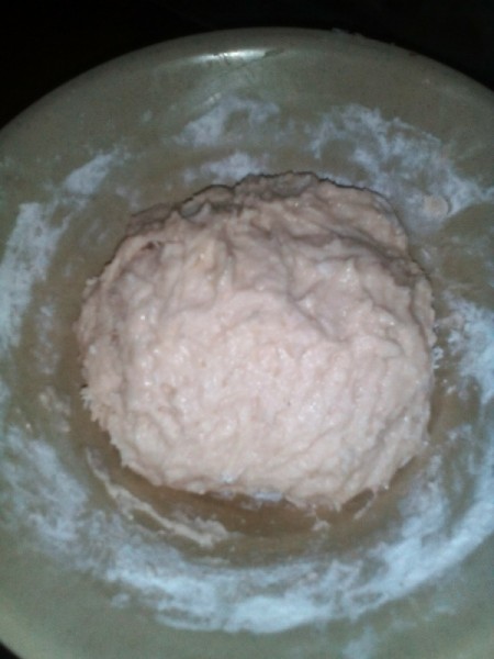 bread dough rising in bowl