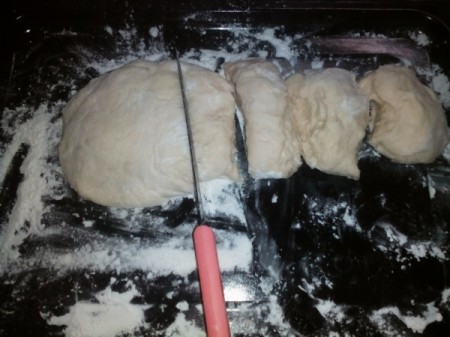cut bread dough on pan