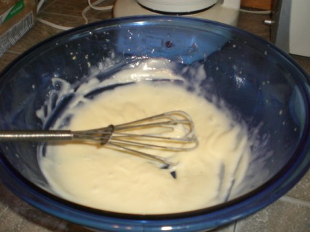 Mayonnaise being mixed in bowl