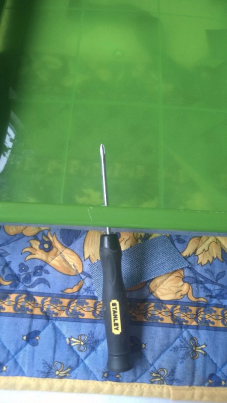 Refurbishing a Neon Drawer Unit for My Kitchen - poking hole for pull