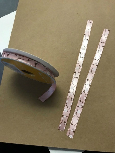 Repurpose Cylinder Container as Jewelry Stand - measure two pieces of ribbon to wrap around the ends