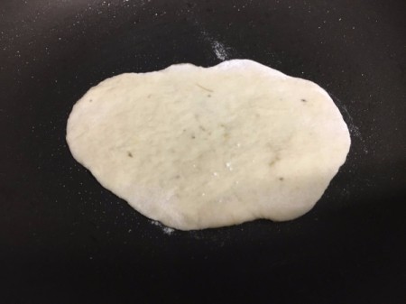 flatbread cooking in pan