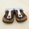 A pair of well worn Birkenstock brand sandals.