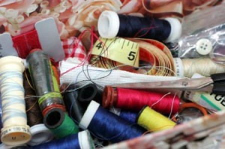 Thread and other sewing supplies in a box