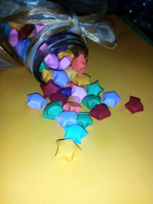 Folded Paper Stars in a Jar - stars spilling from jar