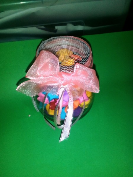 Folded Paper Stars in a Jar - ribbon and large pink bow tied around jar